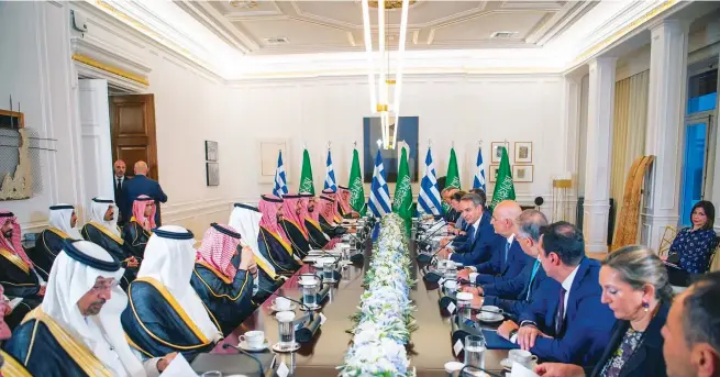  ?? SPA ?? Crown Prince Mohammed bin Salman leads a Saudi delegation in Athens opposite Greek Prime Minister Kyriakos Mitsotakis. The visit led to a raft of new deals covering energy, defense, culture and telecommun­ications.