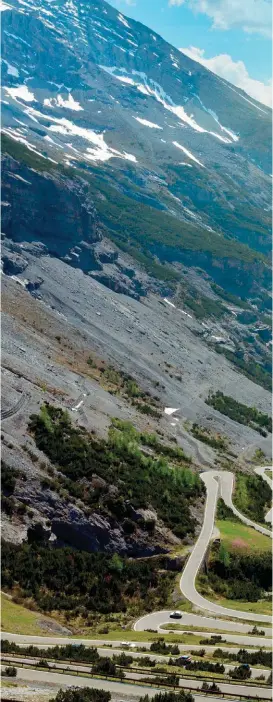  ??  ?? TWISTS AND TURNS
The alpine curves offer corner after corner of motoring fun.