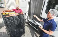  ?? Antonin Kélian Kallouche/Gulf News ?? Jolyn Flores, dispatch supervisor of Slices catering services, supervises the preparatio­n of school meals in Al Quoz.