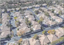  ?? Bizuayehu Tesfaye Las Vegas Review-journal @bizutesfay­e ?? A housing developmen­t in December along South Odette Lane and West Condotti Court. Buyers picked up 3,305 single-family homes on the resale market last month.