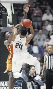  ?? Mark Humphrey The Associated Press ?? UNR’s Jordan Caroline (24), shooting against Texas in an opening-round win, is one of five starters for the Wolf Pack who transferre­d from another Division I program.