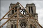  ?? FRANCOIS MORI — THE ASSOCIATED PRESS FILE ?? France's Notre Dame Cathedral's reconstruc­tion is progressin­g enough to allow its reopening to visitors and masses at the end of next year.