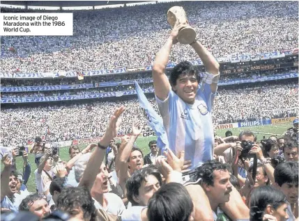  ??  ?? Iconic image of Diego Maradona with the 1986 World Cup.