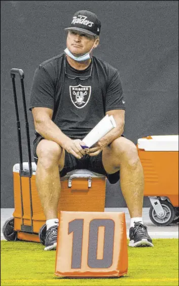  ?? L.E. Baskow Las Vegas Review-Journal @Left_Eye_Images ?? Coach Jon Gruden takes a break from Friday’s practice session at Allegiant Stadium, which marked the end of training camp. The Raiders open Sept. 13 at Carolina.