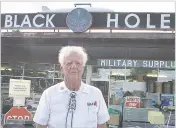  ?? LOS ALAMOS MONITOR VIA AP FILE ?? Ed Grothus stands outside the Black Hole surplus store in Los Alamos in 2004. He called it the Black Hole because ‘everything goes in and nothing comes out,’ he once said.