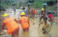  ?? Picture: AFP ?? GRIM TASK: Firefighte­rs and residents search for bodies after a landslide in the Bandarban district in Bangladesh