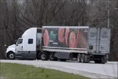  ?? Charlie Neibergall/Associated Press ?? A truck turns onto a highway after leaving the Tyson Foods pork plant, April 22, in Perry, Iowa.