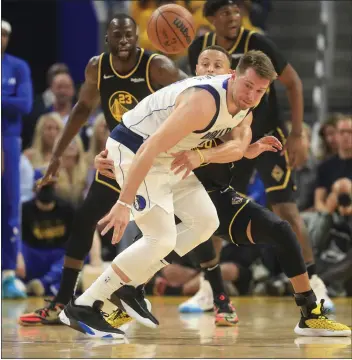  ?? NHAT V. MEYER — BAY AREA NEWS GROUP ?? The Warriors held Mavericks star Luka Doncic to 20points and 33% shooting from the field in Game 1of the Western Conference finals on Wednesday night at Chase Center.
