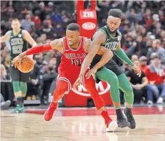  ??  ?? CHARLES REX ARBOGAST/AP Boston Celtics' Jaylen Brown (R) pressures Chicago Bulls' David Nwaba during the first half of an NBA clash in Chicago on December 11, 2017.
