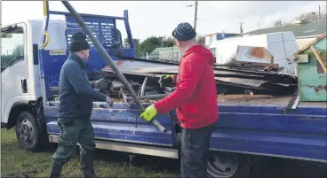  ?? (Pic: John Ahern) ?? METAL MEANS MONEY: The scrap metal collection in Araglin has been further extended. Pictured unloading last weekend are club volunteers, Maurice Reidy and Eamon Hickey.