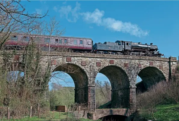  ??  ?? Above: With Ian Walker on the footplate, Ivatt 2MT 2-6-0 No. 43106 crosses Borle viaduct between Highley and Arley on April 17.