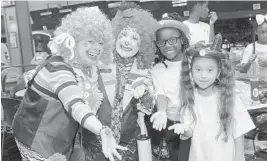  ??  ?? Clowns on Call’s Twinkle Toes and Cutie Pie with Adreane Meance and Lillian Winston