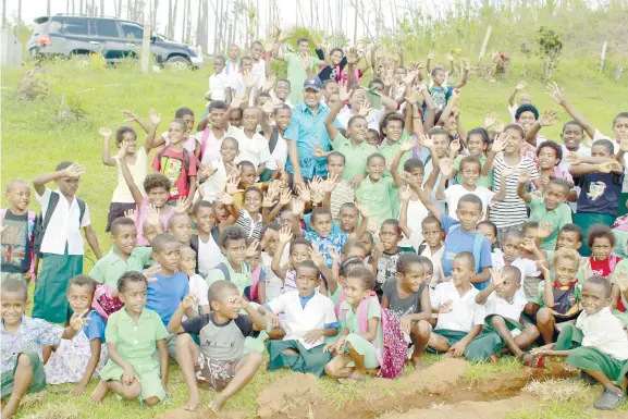  ?? Photo: Viliame Vaganalau ?? PICTURED: Prime Minister Voreqe Bainimaram­a with students of Tokaimalo District School in Ra yesterday. This was an unexpected stop-over as the PM responded to the students urging him to meet them.