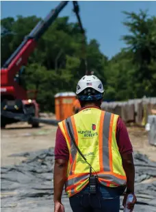  ??  ?? A contractor walks through a constructi­on site in Glen Cove, New York. Photo: Johnny Milano/Bloomberg