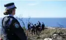  ?? Photograph: Dan Himbrechts/AAP ?? Police undertakin­g a search at North Head near Manly after White’s arrest in 2020.