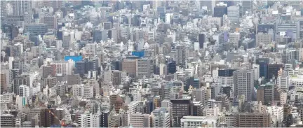  ??  ?? MEDIUM-RISE and low-rise residences and office buildings are seen from the first observator­y deck of Tokyo Sky Tree in Tokyo on Oct. 30, 2011.