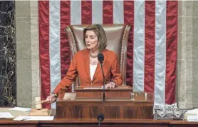  ?? PHOTOS BY J. SCOTT APPLEWHITE/AP ?? House Speaker Nancy Pelosi announces the passage of the gun safety bill on Friday. She underscore­d its significance to her party by taking the unusual step of presiding over the vote and announcing the result from the podium.