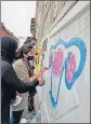  ?? HT PHOTO ?? Arts College students making graffiti on the wall of a flyover to sensitise girls about early marriage, in Lucknow on Wednesday.