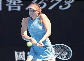  ?? GETTY IMAGES ?? Maria Sharapova plays a backhand in her 6-0, 6-0 victory over Harriet Dart in 63 minutes in the first round of the Australian Open on Monday.