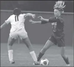  ?? Staff photo/jake Dowling ?? St. Marys’ Katie Lucas (25) steals the ball away from Elida’s Brooke Reese during the first half of Monday’s Western Buckeye League girls soccer match at Roughrider Field.