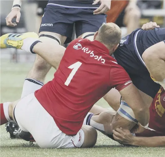  ??  ?? 0 David Denton, being tackled by Canada’s Noah Barker during Scotland’s 48-10 victory in Edmonton last weekend, is determined to become a constant presence in head coach Gregor Townsend’s side.