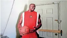  ??  ?? A large cutout of Shaquille O’Neal stands in the home Pam Burford in Oklahoma City. O’Neal nicknamed Burford’s son, Auri Allen, ‘Baby Shaq’.