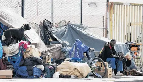  ?? Luis Sinco
Los Angeles Times ?? HOMELESSNE­SS COSTS the city of L.A. $100 million a year, according to a recent report by the city administra­tor, who described the response as fractured and dysfunctio­nal. Now, City Council members are calling for a committee focused exclusivel­y on...