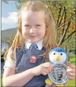  ?? 15_MOD42DM8_poetry ?? Esme McLeod, seven, Bunsgoil Achadh na Creige, with her Mòd penguin.