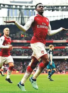  ?? AFP ?? Arsenal’s Danny Welbeck (right) celebrates with Jack Wilshere after scoring the team’s third goal during the Premier League match against Southampto­n on Saturday.