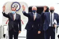  ??  ?? Pence, center, exits Air Force Two with Health and Human Services Director Alex Azar, left, and CDC Director Robert Redfield at the Air National Guard 164th Airlift Wing in Memphis.