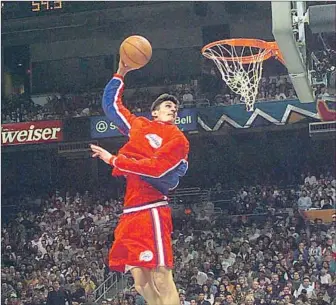  ?? Barry Gossage Allsport ?? WITH a Pearl Jam set list blaring, Brent Barry, still wearing his Clippers warmup jacket, competes in the 1996 slam dunk contest. The event has evolved into a showcase for props and celebrity cameos.