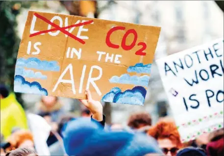  ?? AFP ?? Protesters demonstrat­e during a strike against government­al inaction towards climate breakdown and environmen­tal pollution in Lausanne, Switzerlan­d, on January 17.