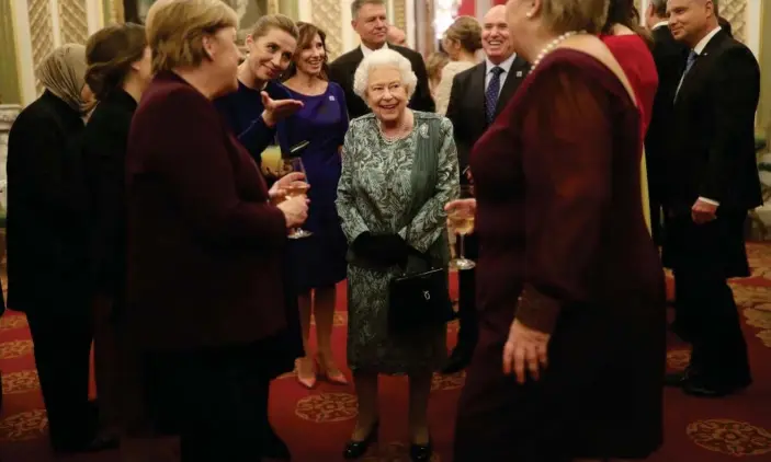  ??  ?? The Queen talks to guests during a reception at Buckingham Palace to mark 70 years of the Nato alliance. Photograph: Yui Mok/Pool/EPA