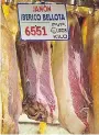  ??  ?? Prized “jamón iberico de bellota” is Spain’s choicest cured ham at the market.