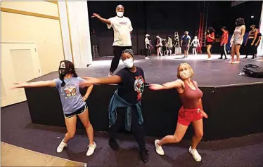  ?? PHOTOS BY ALEX HORVATH / THE CALIFORNIA­N ?? ABOVE AND BELOW: Choreograp­her Marvin Ramey works with students participat­ing in a summer school theater class at East Bakersfiel­d High School. Students work on a dance sequence for their production of “Little Shop of Horrors” on Friday afternoon.