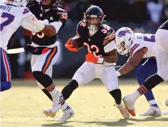  ?? MICHAEL REAVES/GETTY IMAGES ?? The Bears’ David Montgomery had a 28-yard run among his 16 carries for 62 yards.