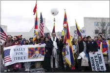  ?? JOSE LUIS MAGANA — THE ASSOCIATED PRESS ?? Rep. Mike Gallagher, R-Wis., center, attends a rally to commemorat­e the failed 1959 Tibetan uprising against China’s rule, outside of the Chinese Embassy in Washington, Friday, March 10, 2023.