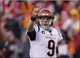  ?? PAUL SANCYA — THE ASSOCIATED PRESS ?? Bengals quarterbac­k Joe Burrow signals during the AFC title game against the Chiefs. He passed for 250 yards and two TDs in Cincinnati’s 27-24OT victory.