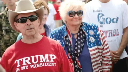  ?? SCOTT OLSON/GETTY IMAGES ?? President Trump supporters attend a rally in May in Elkhart, Indiana.