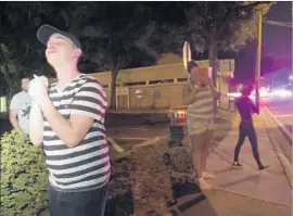  ?? Phelan M. Ebenhack Associated Press ?? BRANDON SHUFORD waits near Pulse on the night of the shooting. It’s unclear how many of the injured were stranded without treatment during the standoff.