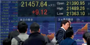  ?? — AFP ?? Japan’s Nikkei stock index logged its longest winning streak in more than half a century.