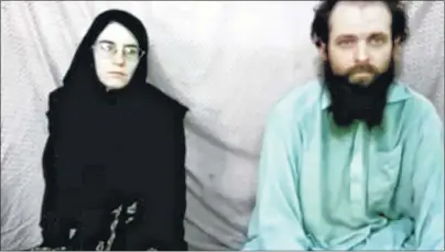  ?? CP PHOTO ?? This still image made from a 2013 video released by the Coleman family shows Caitlan Coleman and her husband, Canadian Joshua Boyle in a militant video given to the family. The American woman, her Canadian husband and their three young children have...