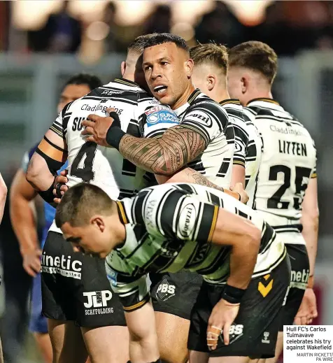  ?? MARTIN RICKETT/ PA WIRE ?? Hull FC’S Carlos Tuimavave celebrates his try against Wakefield