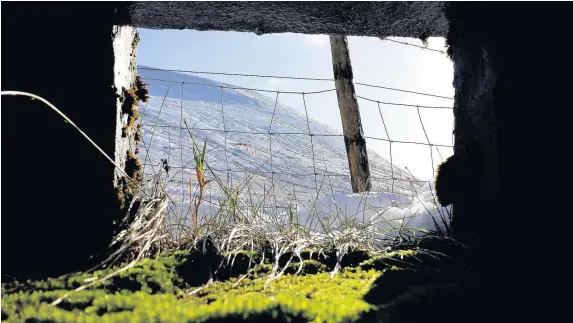  ?? JEFF BRAZEAU ?? Inside looking out from the World War II bunker at the foot of Pen y Fan in the Brecon Beacons