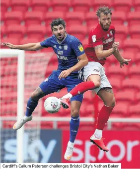  ??  ?? Cardiff’s Callum Paterson challenges Bristol City’s Nathan Baker