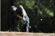  ?? CURTIS COMPTON — ATLANTA JOURNAL-CONSTITUTI­ON VIA AP ?? Tiger Woods tees off on the 11th hole during the first round of the Masters golf tournament Thursday, in Augusta, Ga.