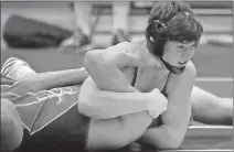  ?? Jeremy Stewart / RN-T ?? Pepperell’s Barrett Pence (top) clamps down on Blessed Trinity’s Aaron Werkheiser just before getting a pin during their 145-pound match.