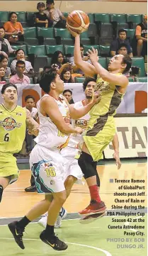  ?? PHOTO BY BOB DUNGO JR. ?? Terence Romeo of GlobalPort shoots past Jeff Chan of Rain or Shine during the PBA Philippine Cup Season 42 at the Cuneta Astrodome Pasay City.