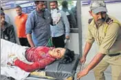  ?? PTI PHOTO ?? A security personnel takes a woman to hospital in Jammu after she was injured in the crossborde­r firing on Saturday.