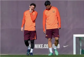  ?? — AFP ?? Barcelona forwards Lionel Messi ( left) and Luis Suarez at a training session at the Joan Gamper Sports Center in Sant Joan Despi on Tuesday.